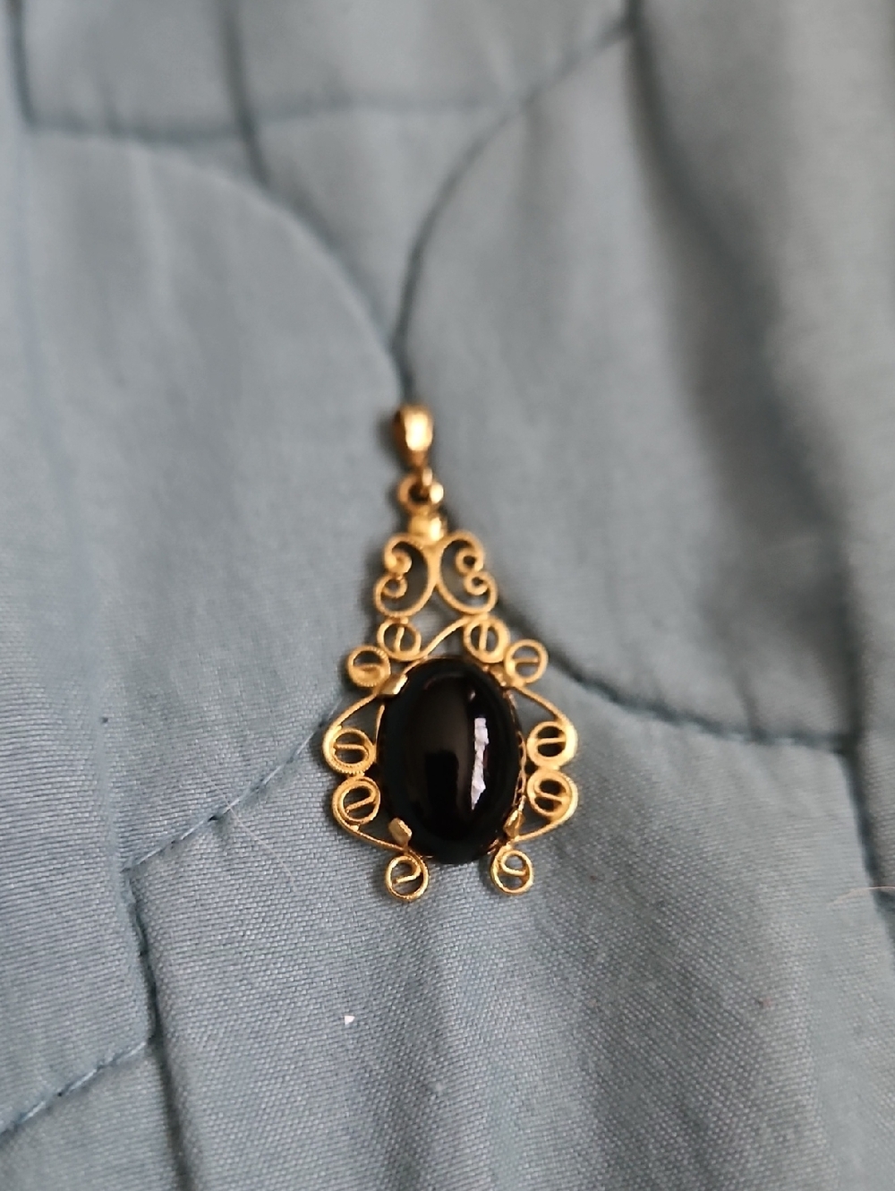 Gold Filigree Pendant Necklace with Black Cabochon